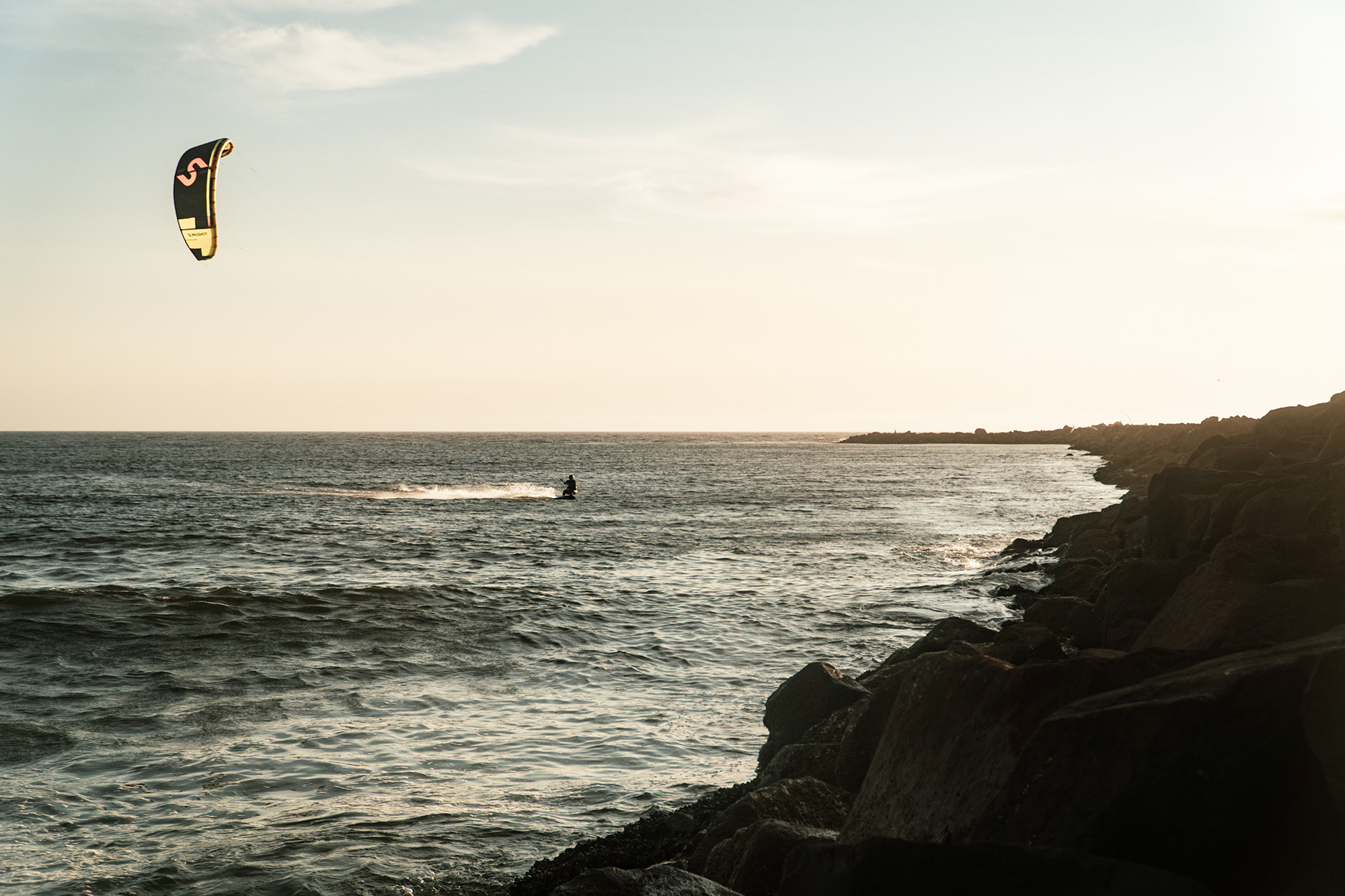 evening ocean rocky shore kiteboarder Florence21
