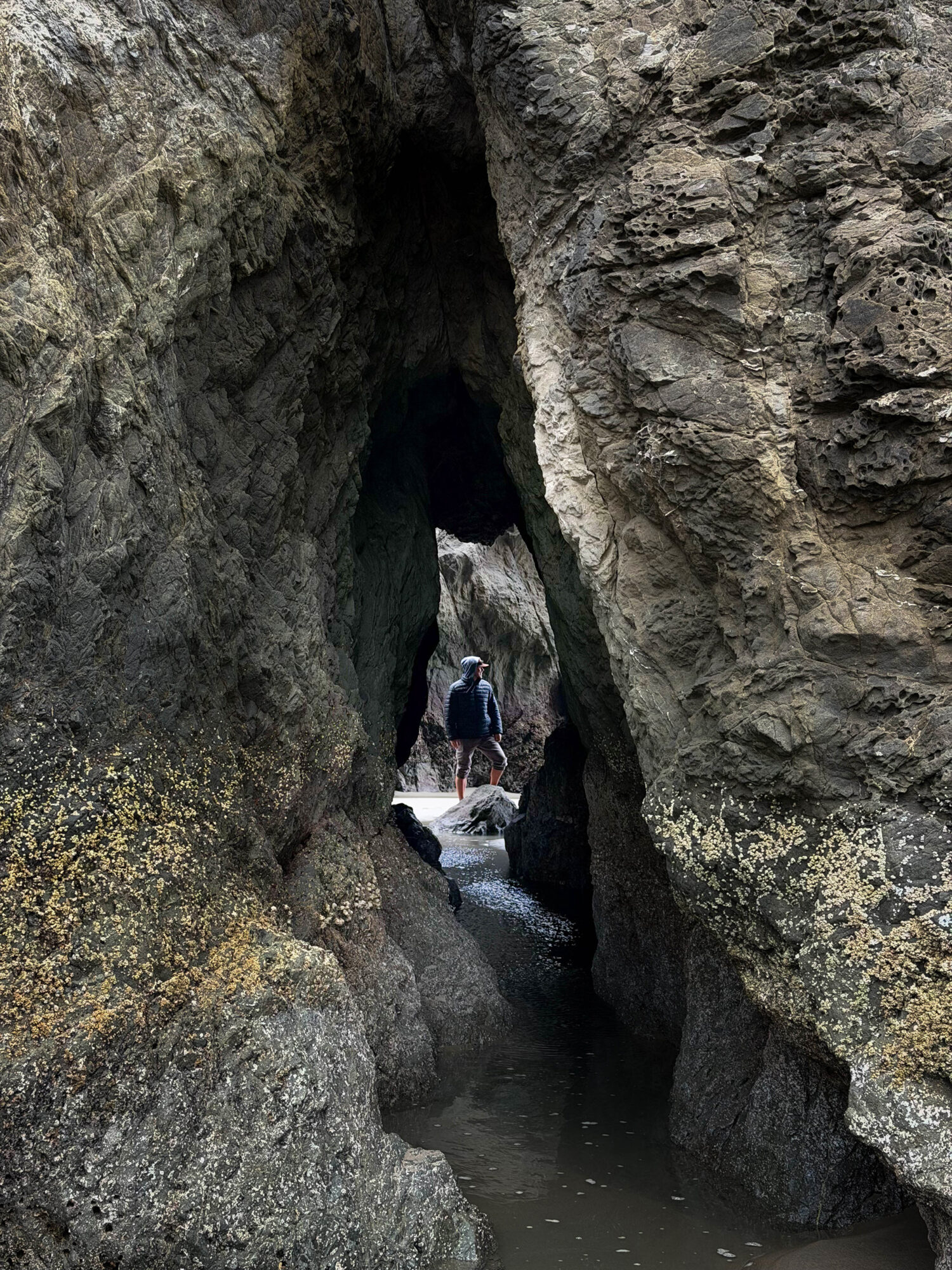 Bandon Beach sea cave hiker